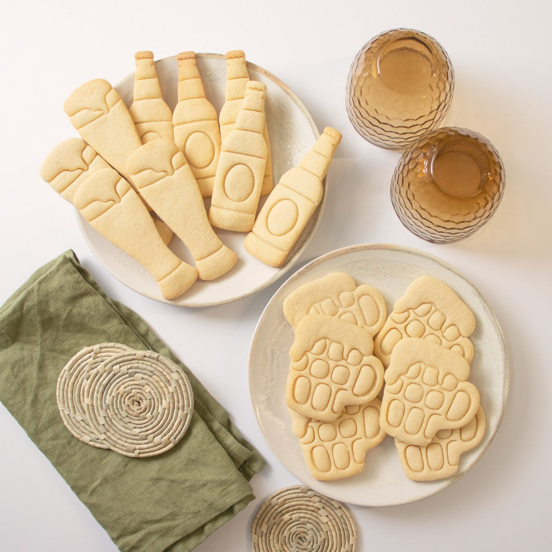 set of 3 beer themed cookies, featuring a beer bottle, a weizen glass and a english tankard mug